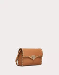 SMALL ROCKSTUD GRAINY CALFSKIN CROSSBODY BAG ALMOND