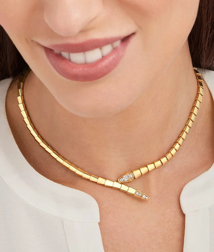 Bob snake gardens yellow gold necklace set with pavé diamonds on the head and tail