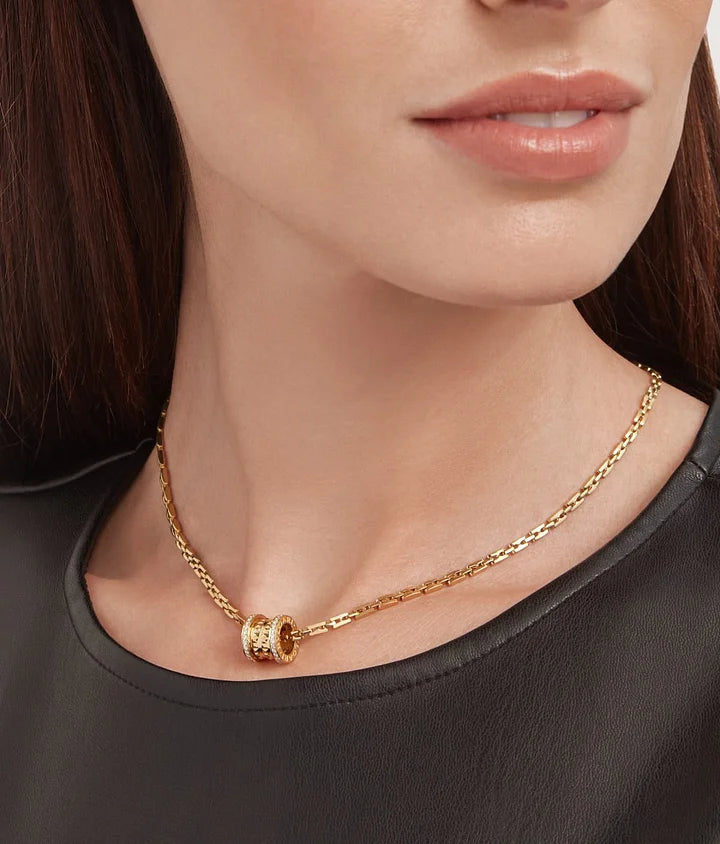 Bob Rollers Adolph yellow gold pendant necklace with studded spiral set with pavé diamonds on the edges