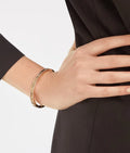 Bob Rollers Cara yellow gold bracelet with studded spiral and pavé diamonds on the edges
