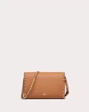 SMALL ROCKSTUD GRAINY CALFSKIN CROSSBODY BAG ALMOND