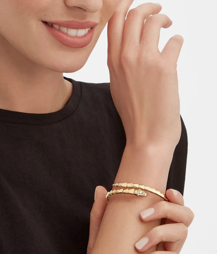 Bob snake fad yellow gold bracelet set with pavé diamonds on the head and tail
