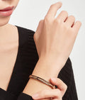 Bob Rollers Cara rose gold bracelet with studded spiral and black ceramic inserts on the edges
