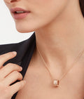 Bob Rollers Adolph necklace with rose gold pendant set with pavé diamonds on the spiral and rose gold chain