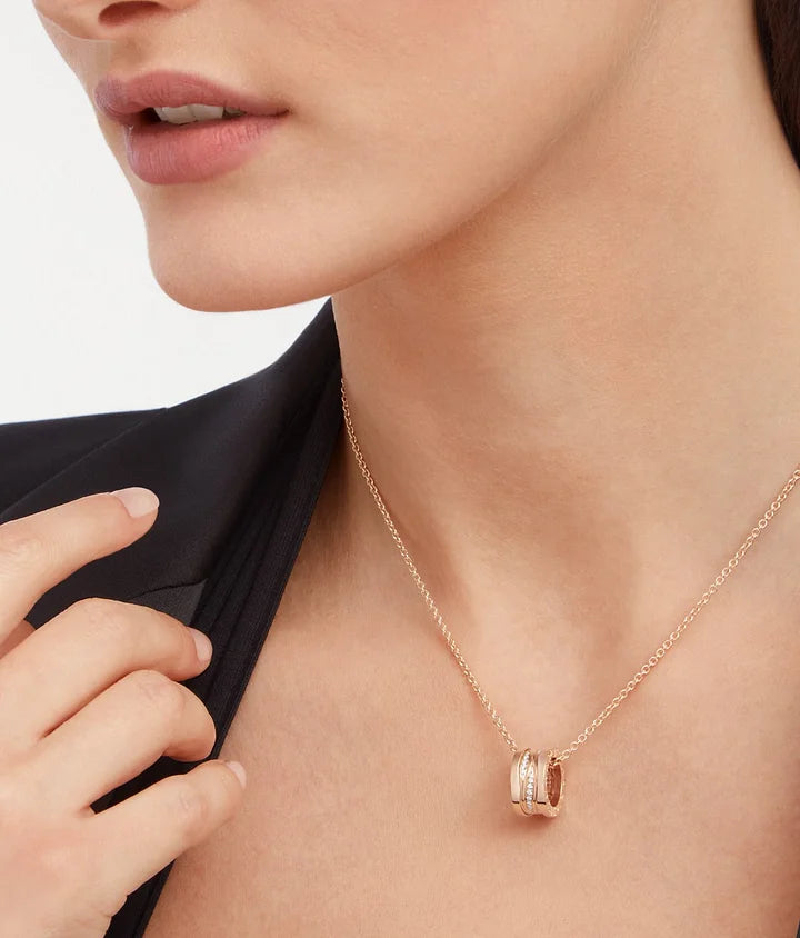 Bob Rollers Adolph necklace with rose gold pendant set with pavé diamonds on the spiral and rose gold chain
