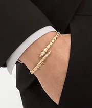 Bob snake fad yellow gold bracelet set with pavé diamonds on the head and tail