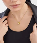 Bob Rollers Adolph yellow gold chain and yellow gold round pendant set with pavé diamonds on the edges