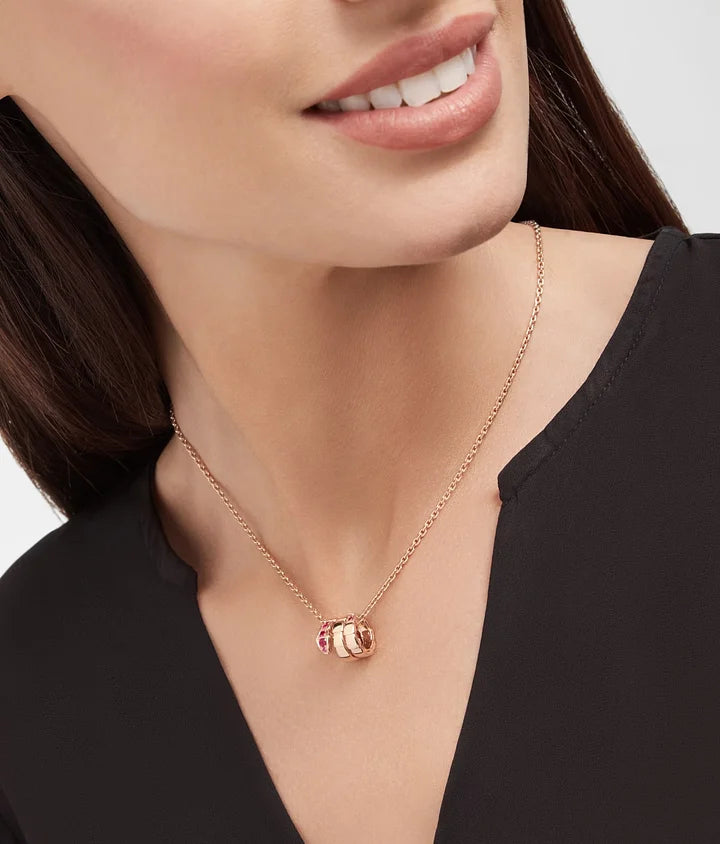 Bob Snake elegant rose gold pendant necklace set with rubies on the head.