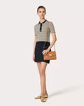 SMALL ROCKSTUD GRAINY CALFSKIN CROSSBODY BAG ALMOND