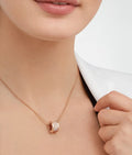 Bob Rollers Adolph necklace with 18 kt rose gold chain and rose gold pendant set with pavé diamonds on the spiral.