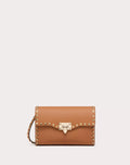 SMALL ROCKSTUD GRAINY CALFSKIN CROSSBODY BAG ALMOND